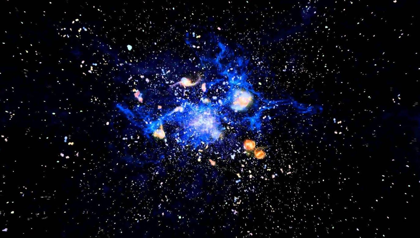 Gromadę galaktyk widzimy w stanie, gdy Wszechświat miał jedynie 3 miliardy lat (fot. ESO)