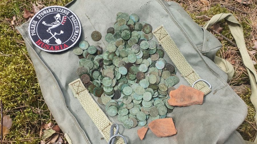 A metal-detecting group unearthed 442 coins in total. Photo: The Polish Searchers' Association "Husaria" via Facebook