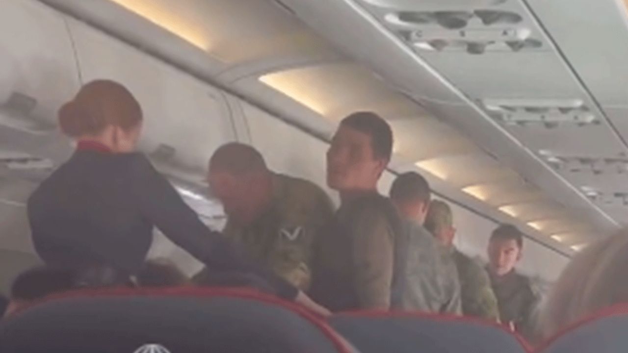 Russian soldiers engaged the plane.  They were returning from the war